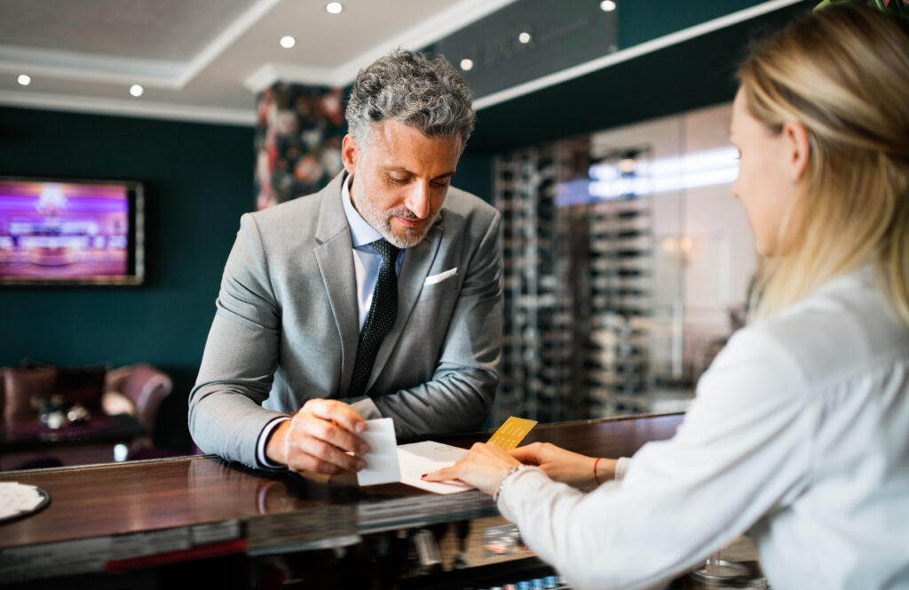 Image of customer at hotel with TV services in background
