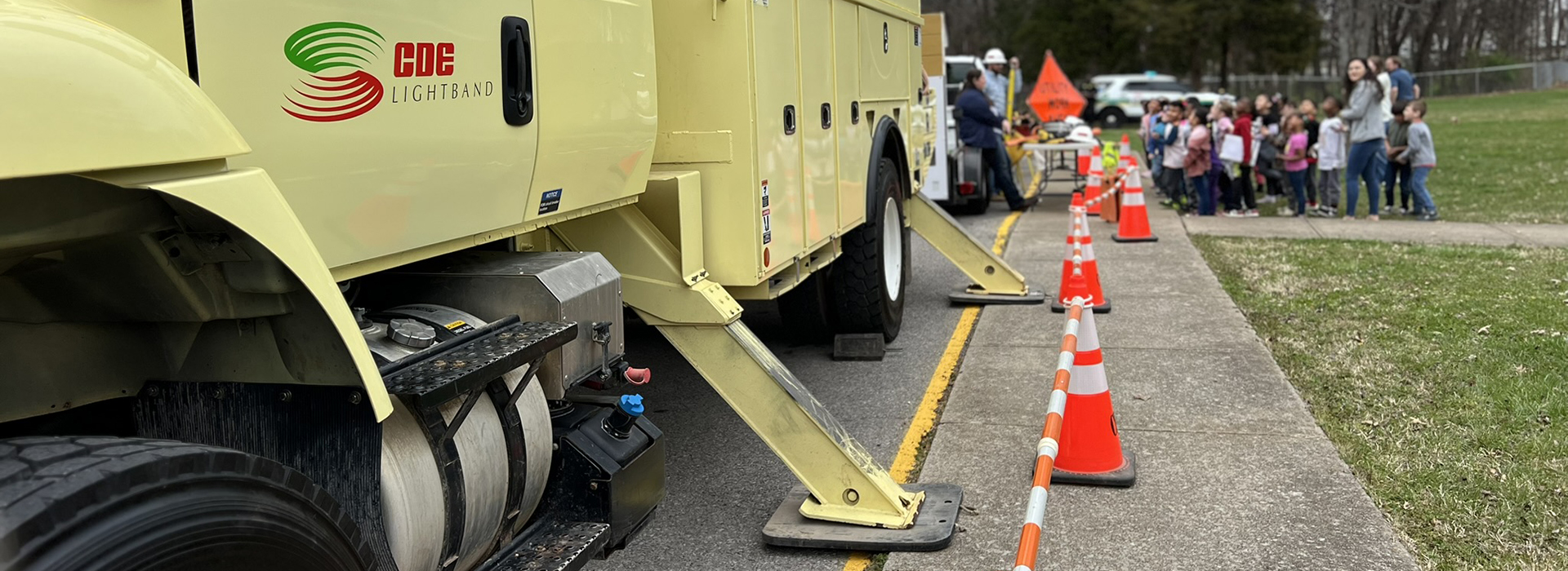 Image of CDE Lightband electrical truck parked outside of school for an educational demonstration